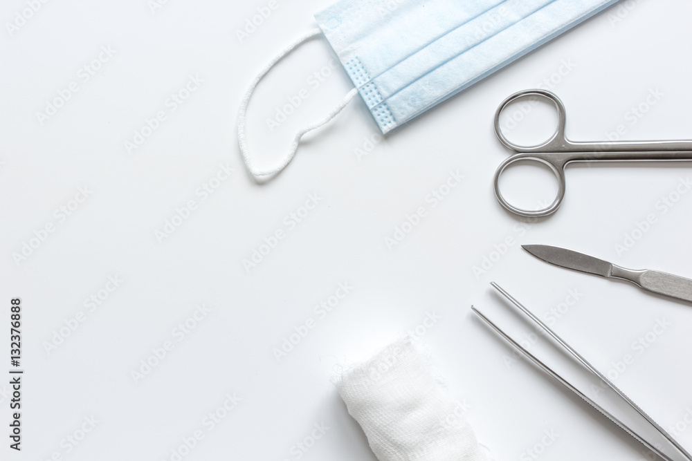 instruments for cosmetic surgery on white background top view