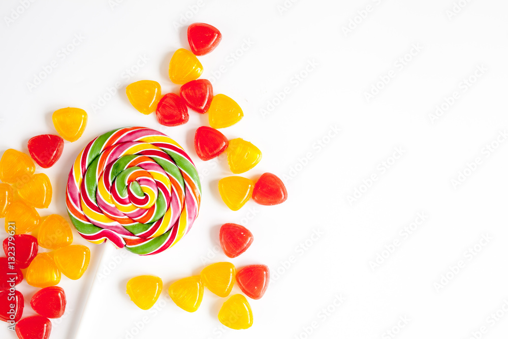 sweets and sugar candies on white background top view