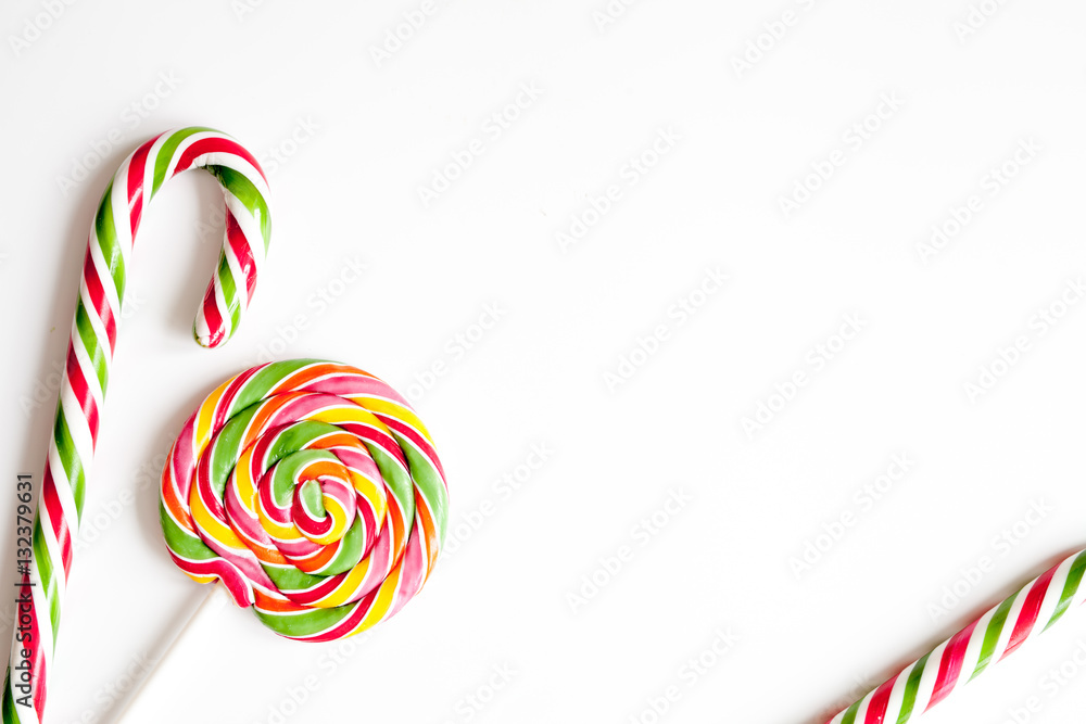 sweets and sugar candies on white background top view