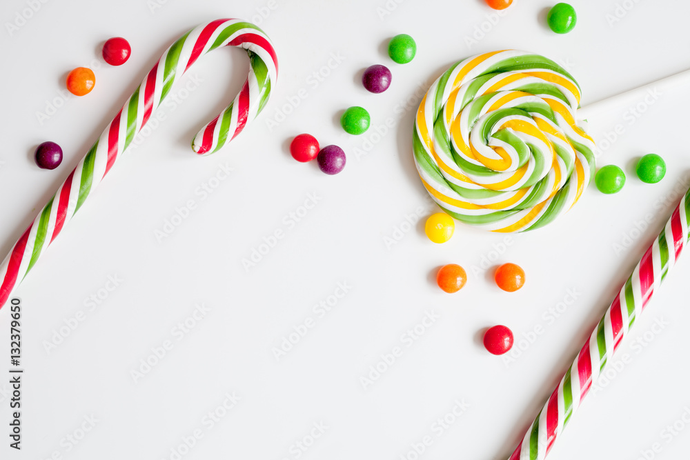 sweets and sugar candies on white background top view