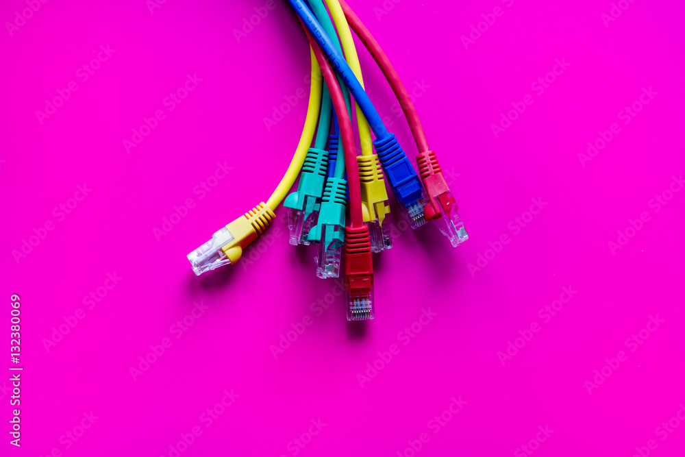 concept network internet cable on pink background close up