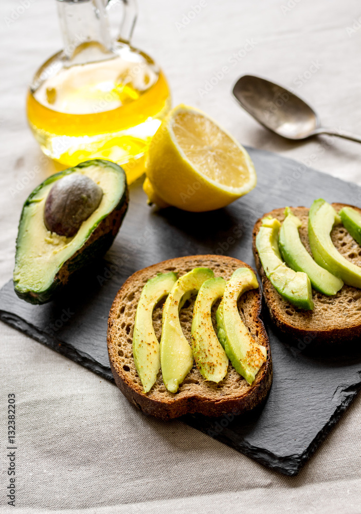 making sandwiches with avocado healthy organic food top view