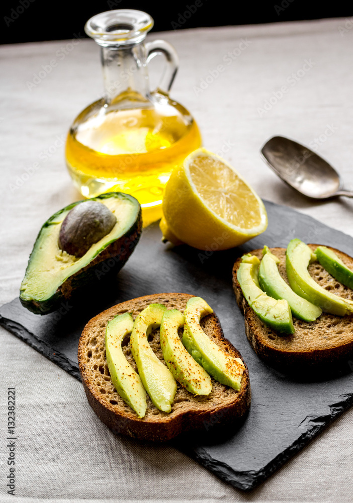 making sandwiches with avocado healthy organic food top view