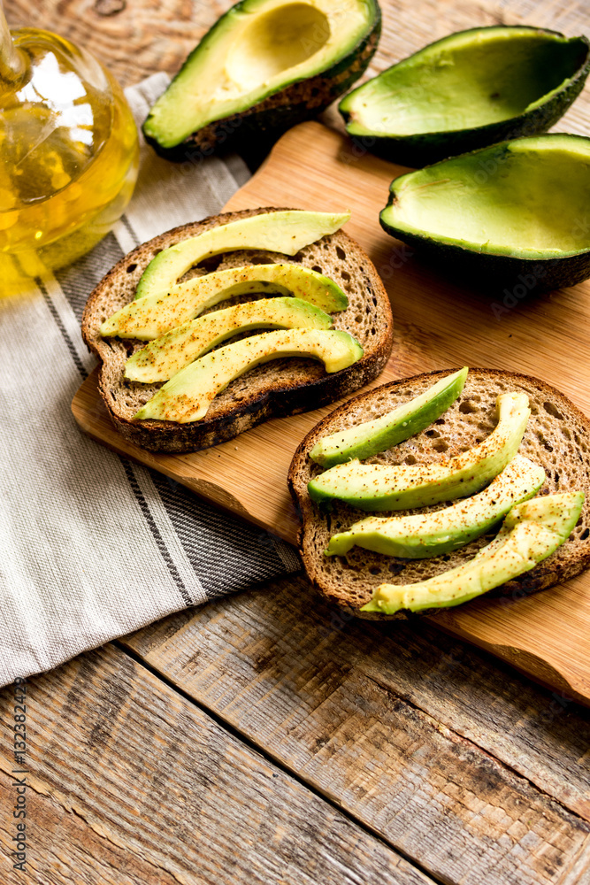 making sandwiches with avocado healthy organic food top view