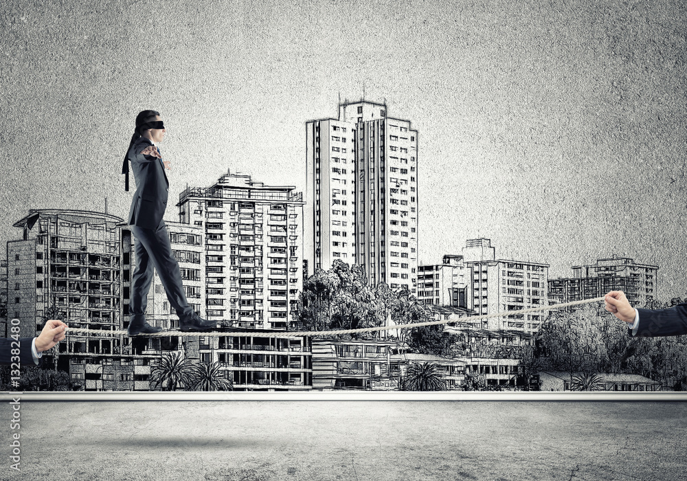 Business concept of risk support and assistance with man balancing on rope