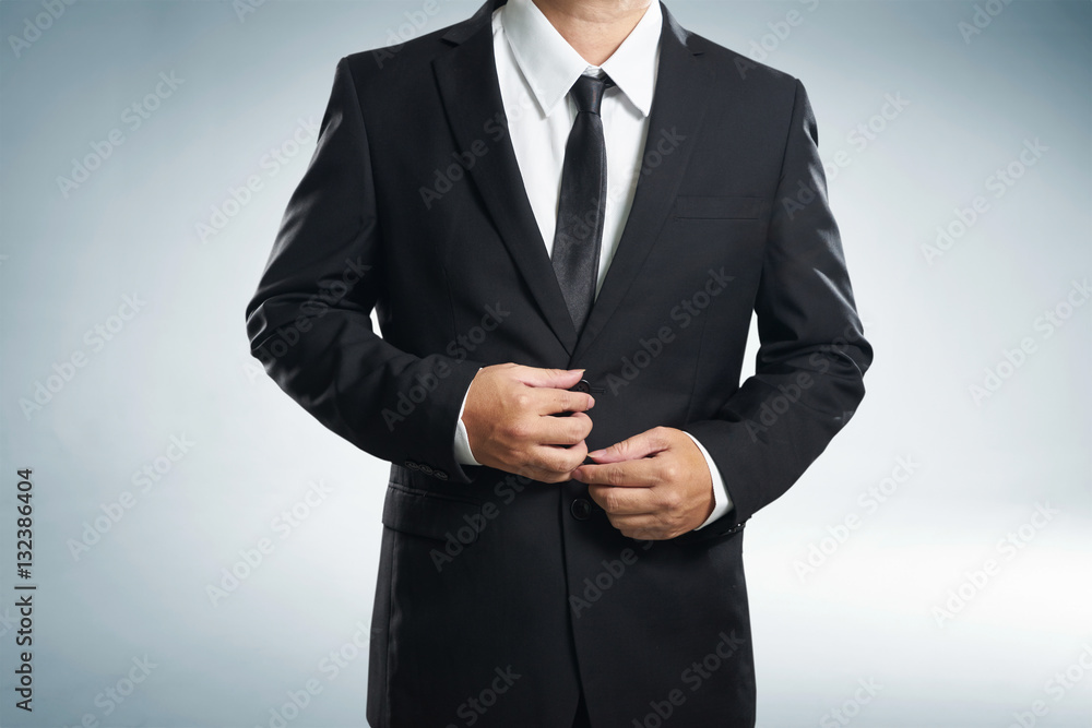 Confidence businessman in black suit , close up .