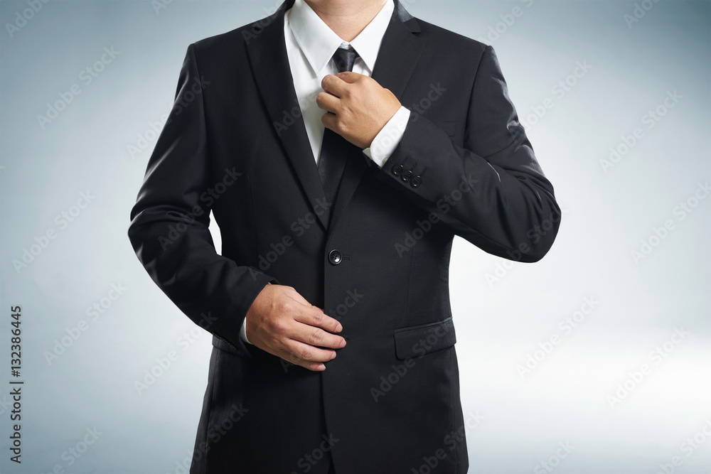 Confidence businessman in black suit , close up .