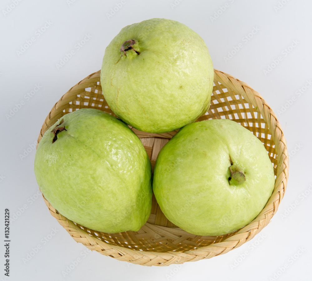 three guavas on a basket