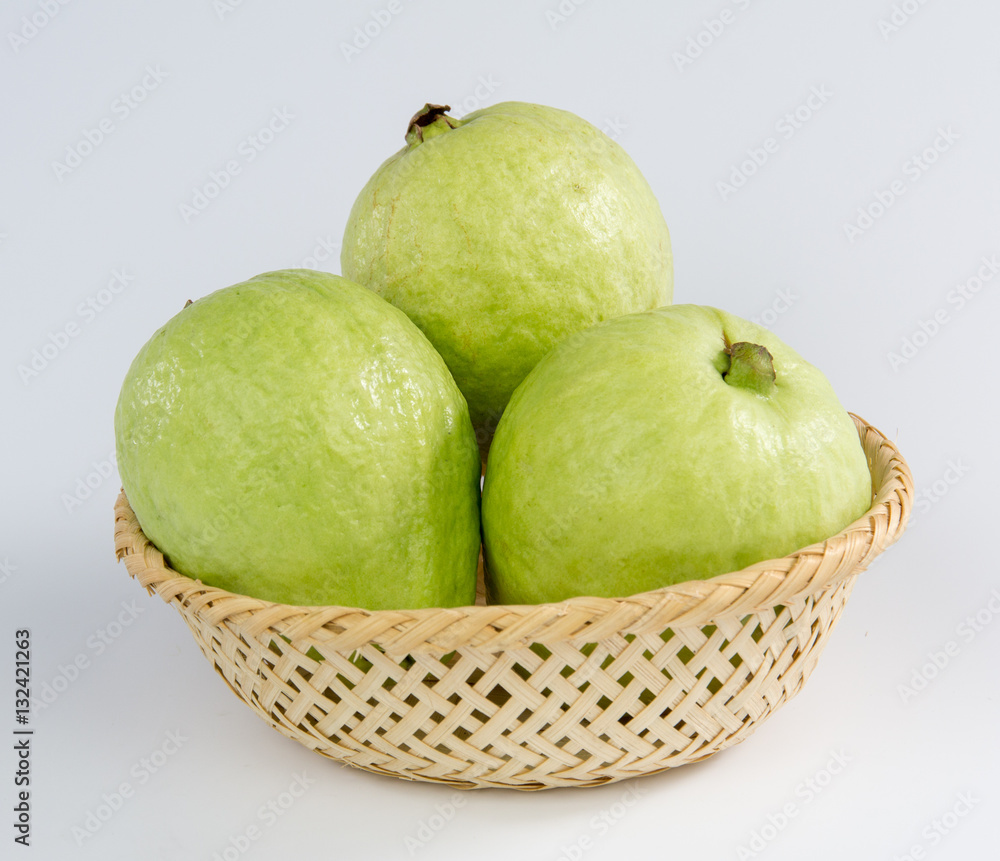 three guavas on a basket