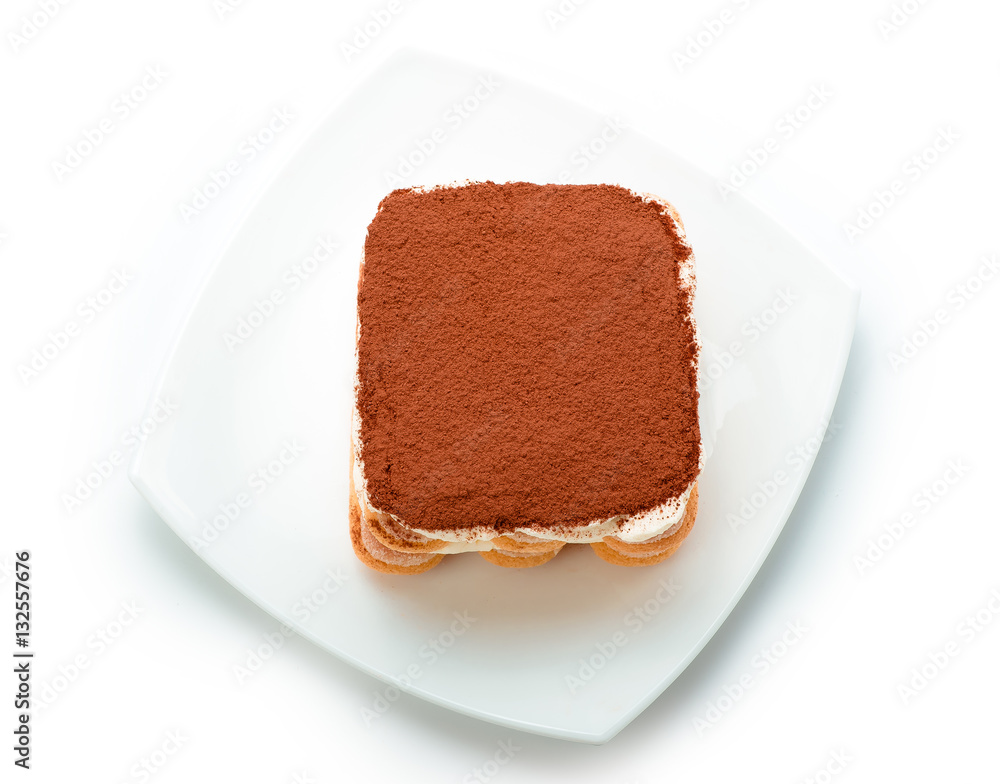 Tiramisu on white plate isolated. Clipping path. Top view.