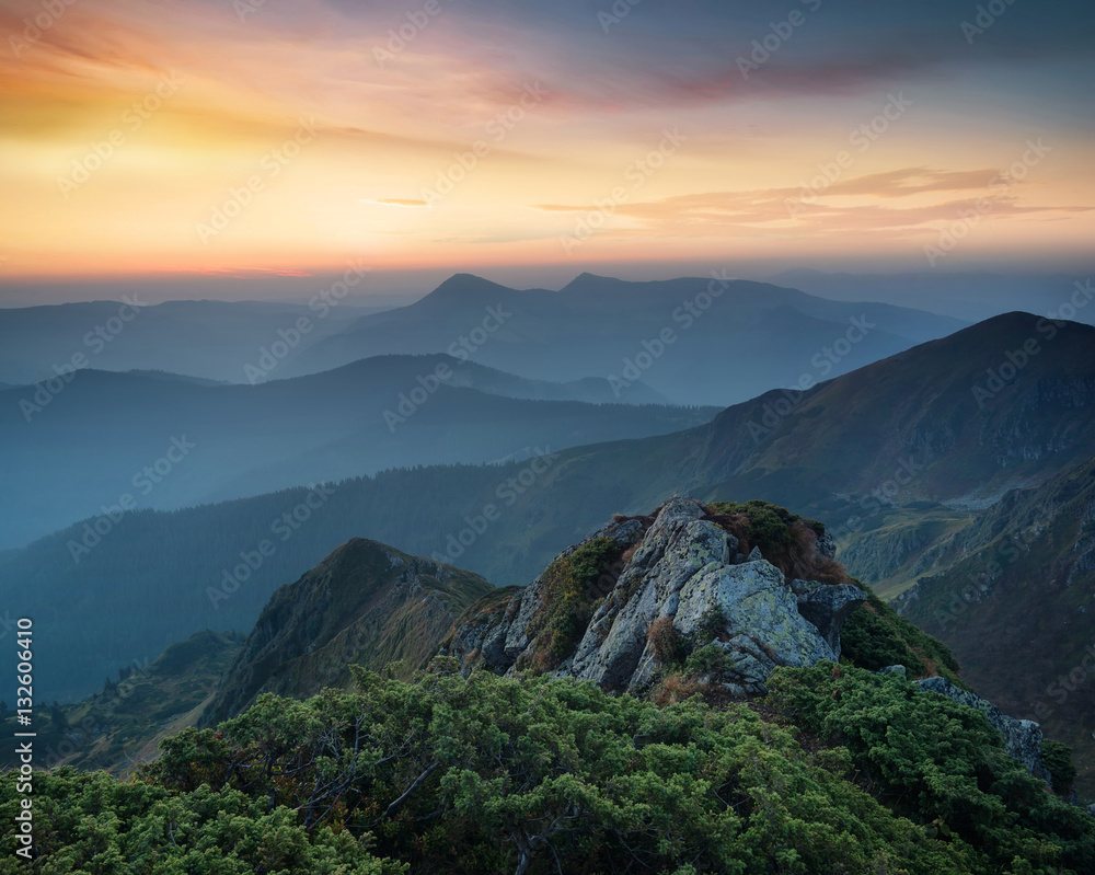 Mountains during sunset. Beautiful natural landscape in the summer time..