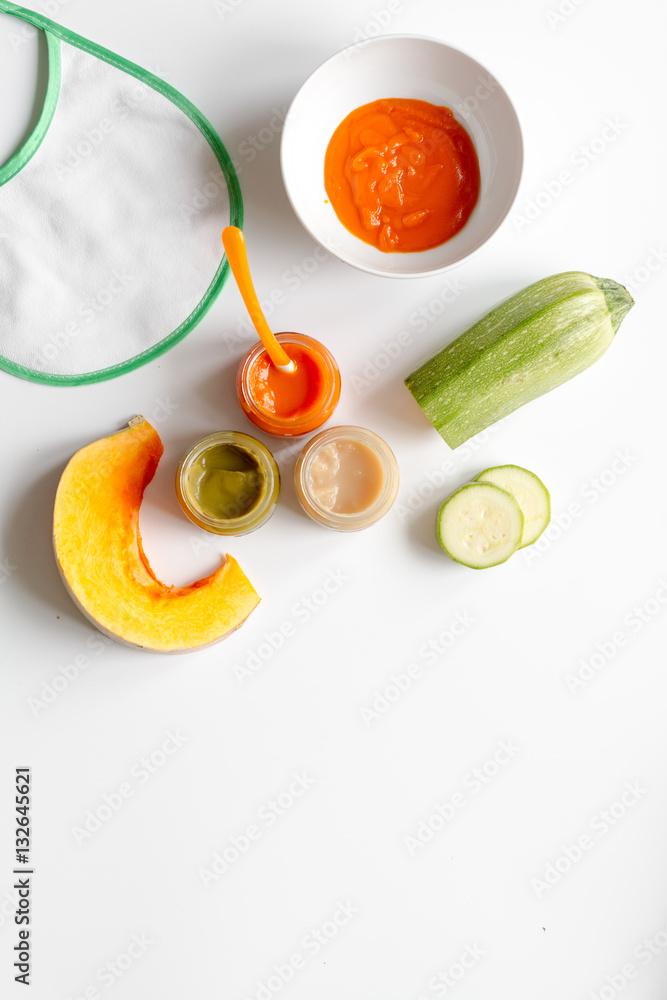 cooking vegetable puree for baby on white background top view