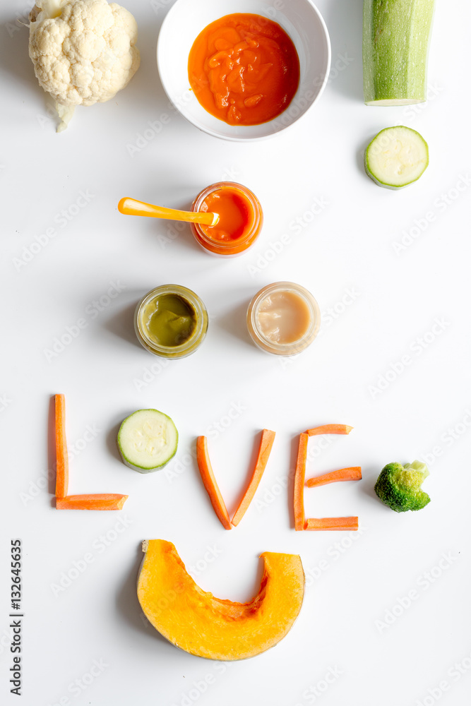 cooking vegetable puree for baby on white background top view