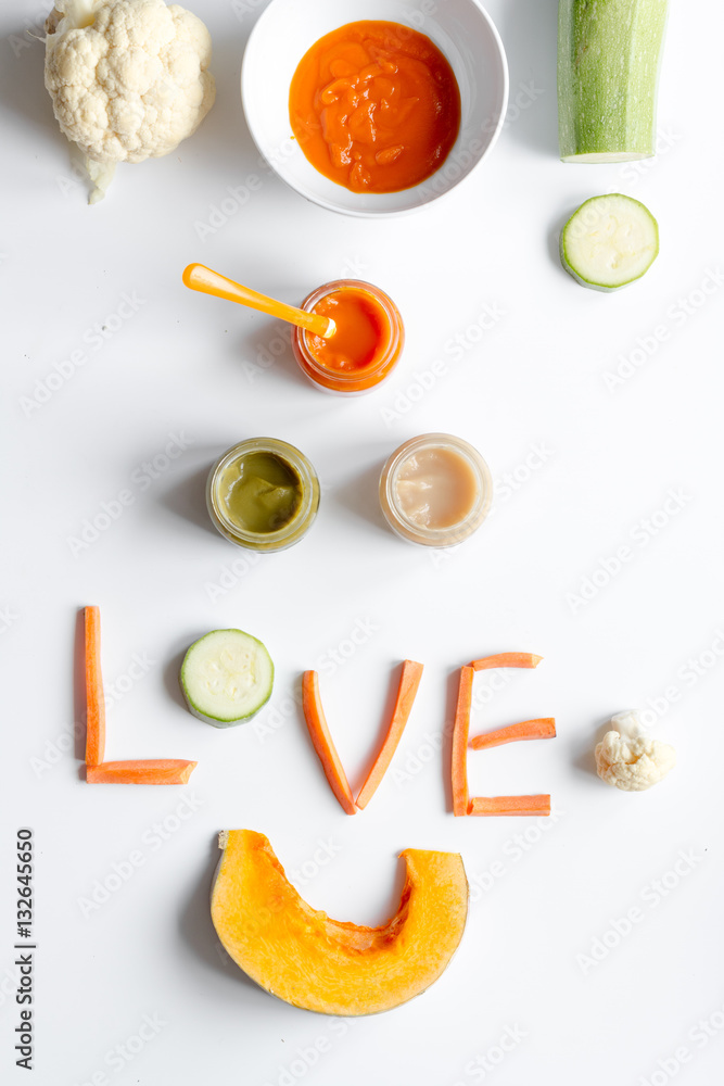 cooking vegetable puree for baby on white background top view