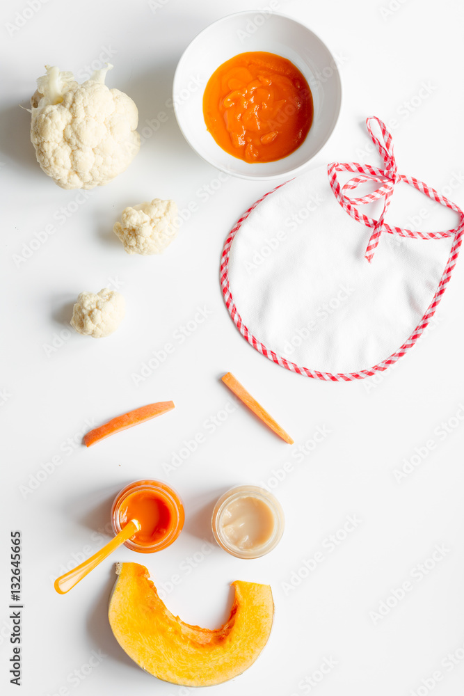 cooking vegetable puree for baby on white background top view