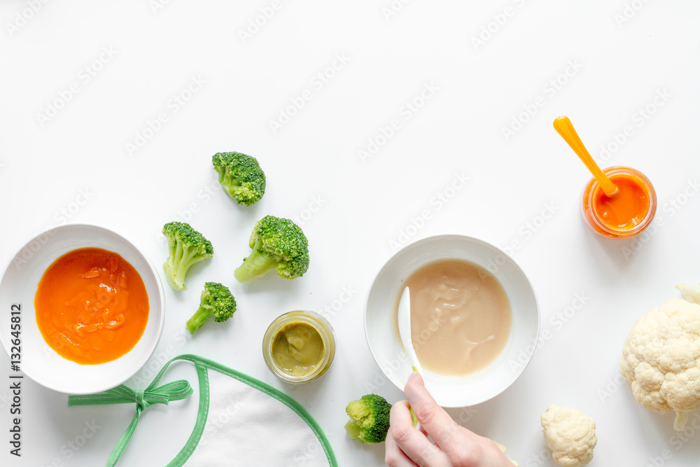 cooking vegetable puree for baby on white background top view