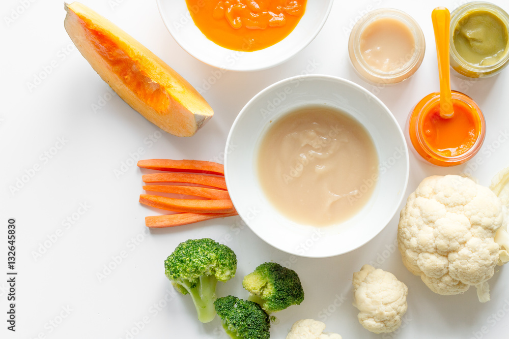 cooking vegetable puree for baby on white background top view