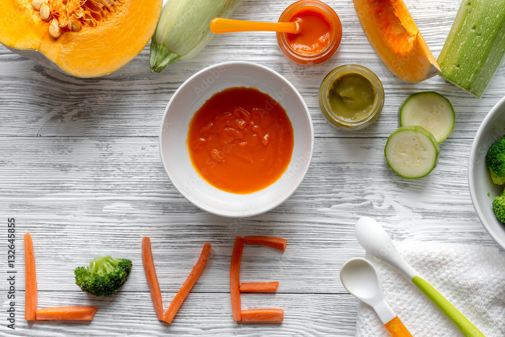 baby vegetable puree on wooden background top view