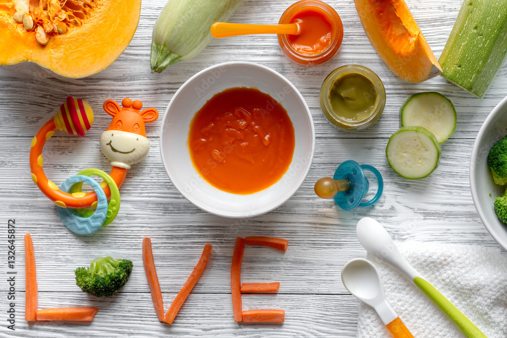 baby vegetable puree on wooden background top view