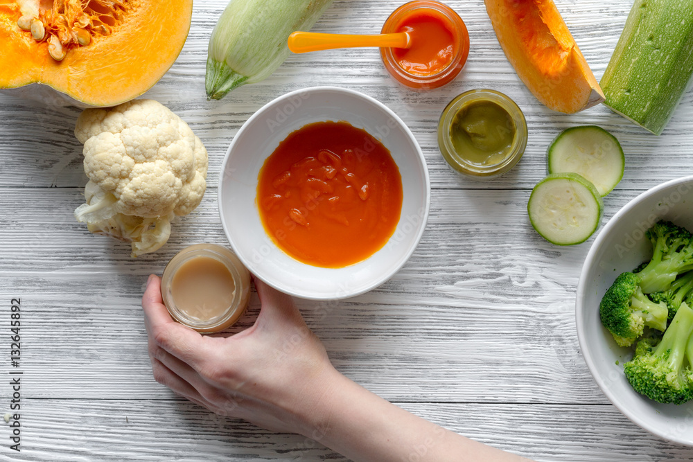 baby vegetable puree on wooden background top view