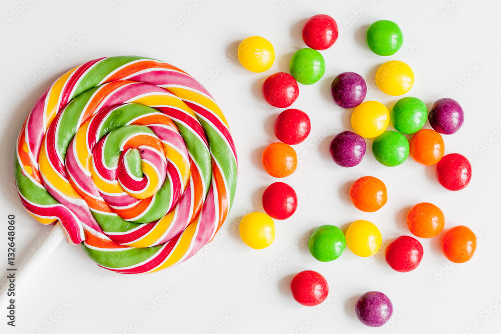 sweets and sugar candies on white background top view