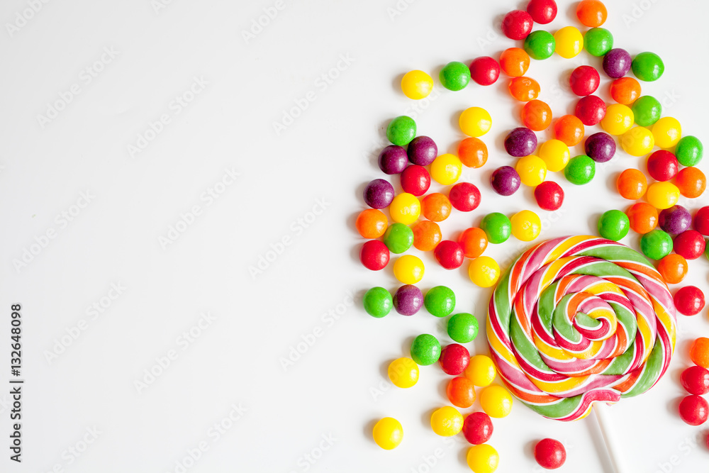 sweets and sugar candies on white background top view