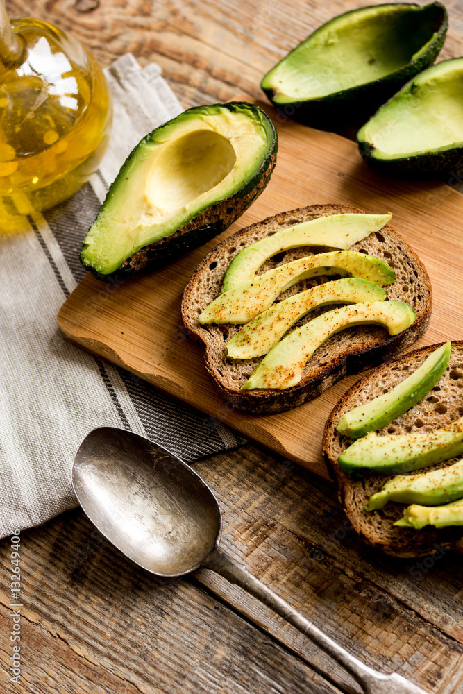 making sandwiches with avocado healthy organic food top view