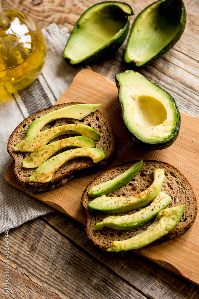 making sandwiches with avocado healthy organic food top view