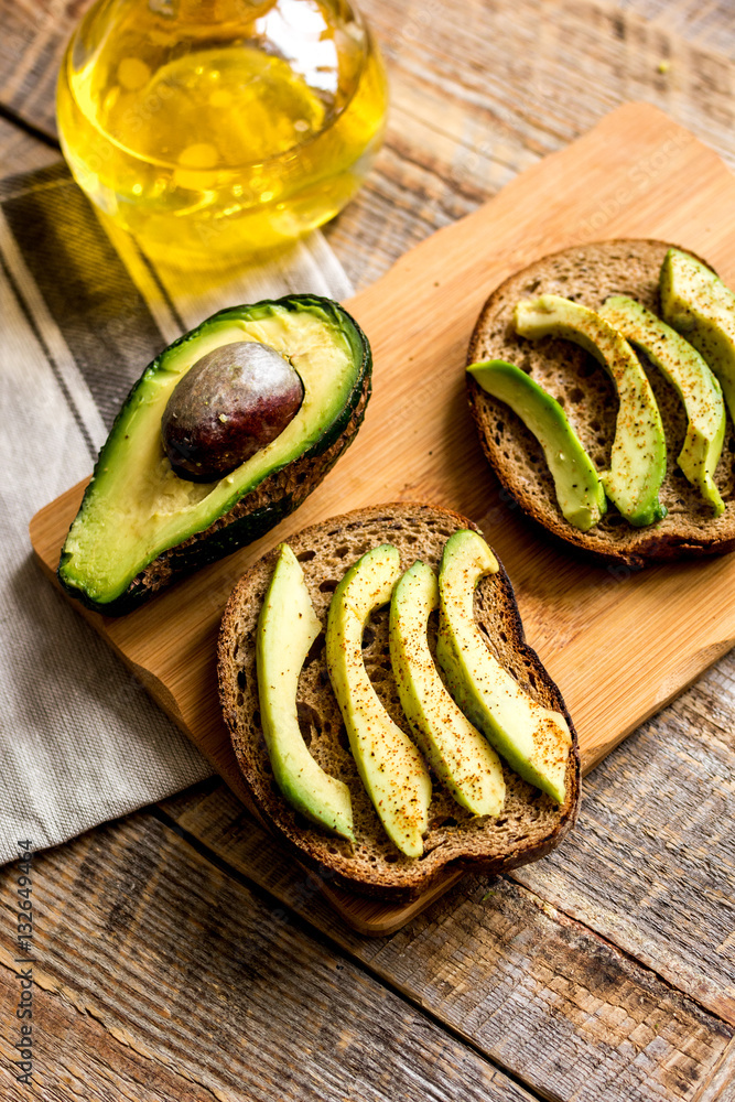 making sandwiches with avocado healthy organic food top view