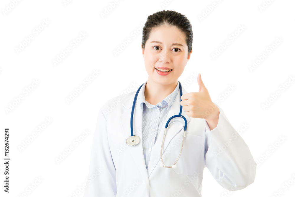 Smiling asian woman doctor with stethoscope show thumb up