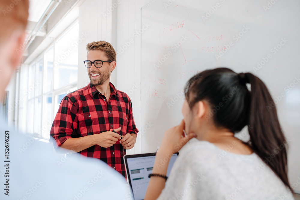 Businessman doing presentation in meeting room