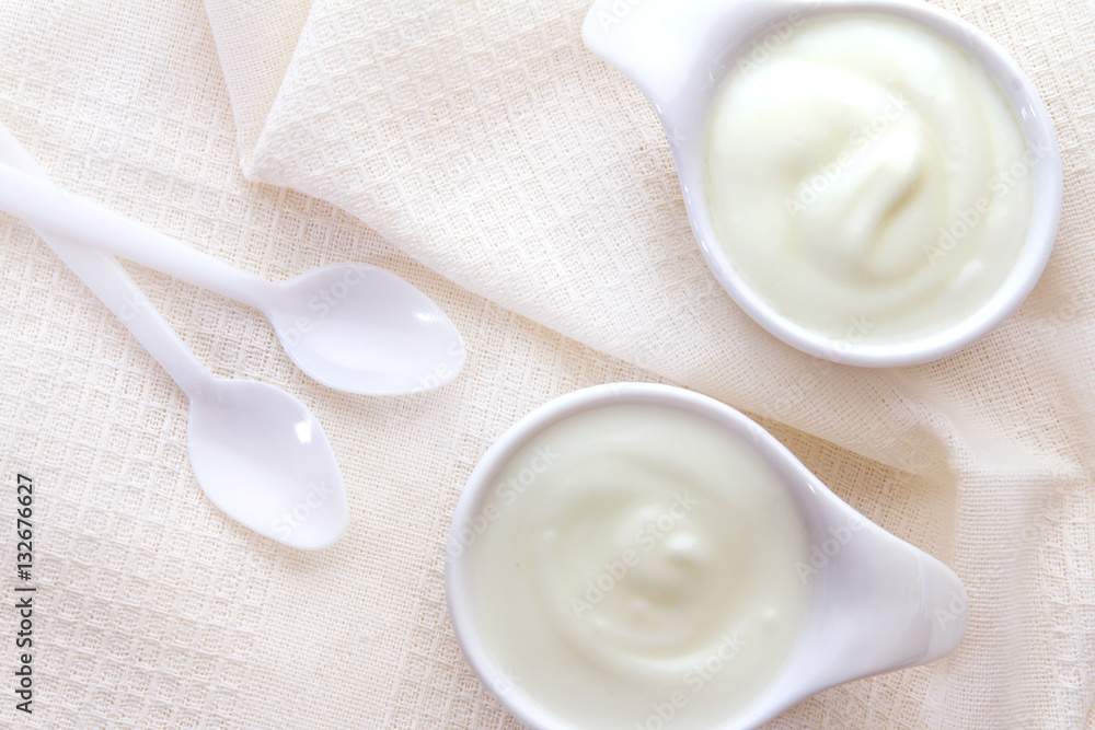 Close up natural creamy white yogurt in cup