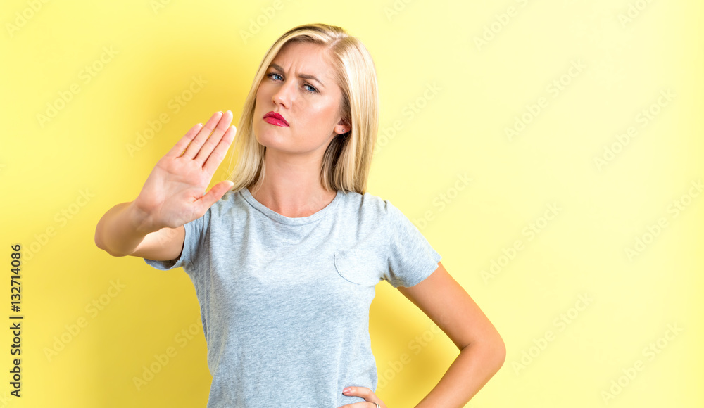 Young woman making a rejection pose