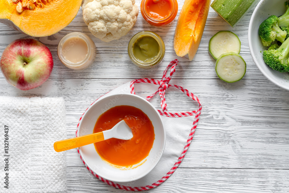 baby vegetable puree on wooden background top view