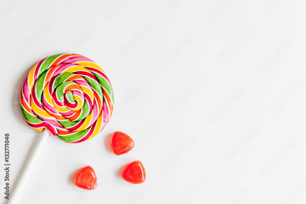 sweets and sugar candies on white background top view