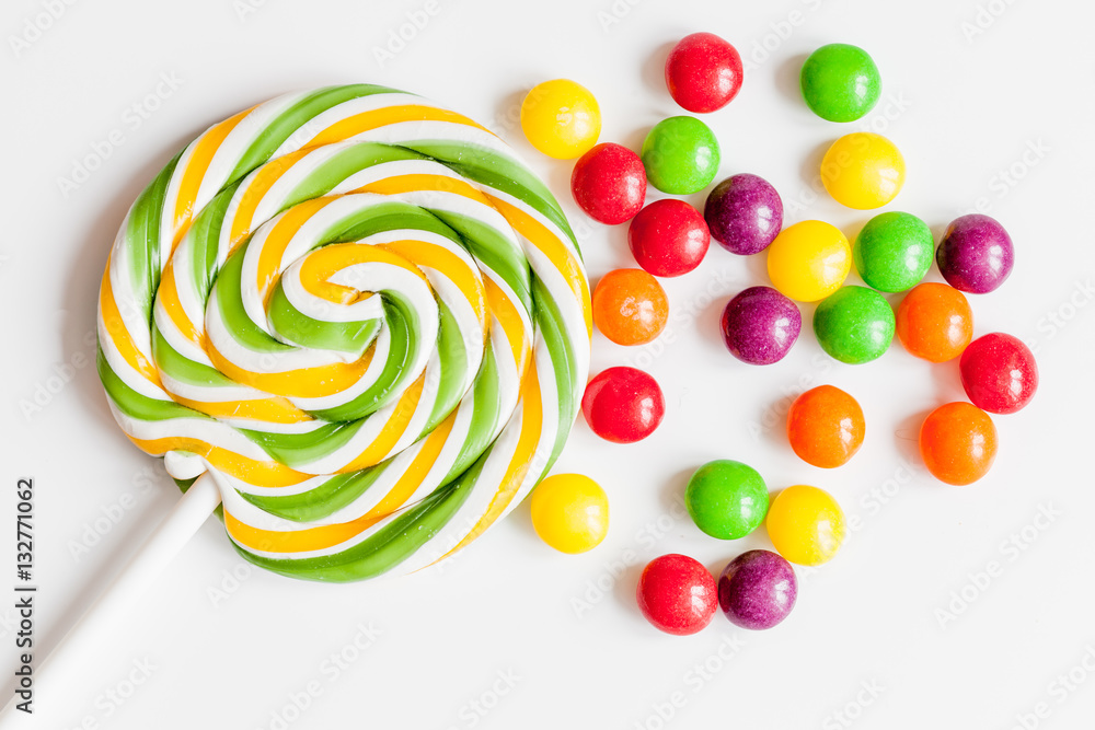 sweets and sugar candies on white background top view