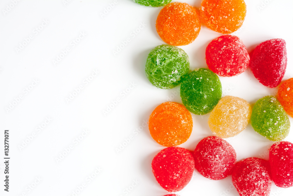 sweets and sugar candies on white background top view