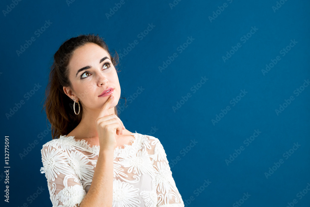 Young woman in a thoughtful pose