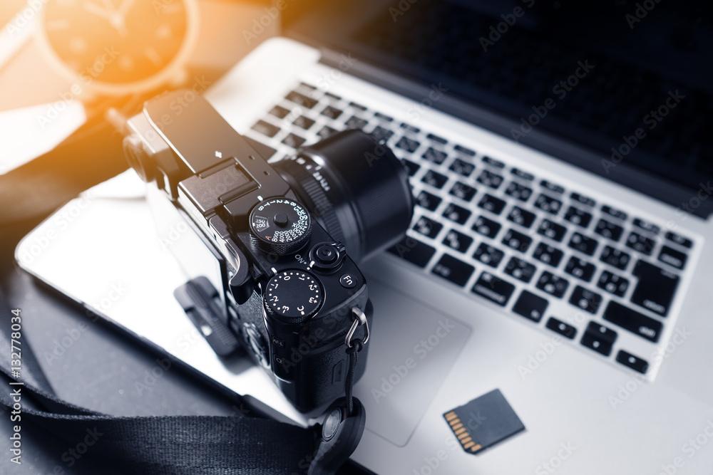 Photographer Workstation. Modern Digital DSLR Camera, Laptop and accessory.