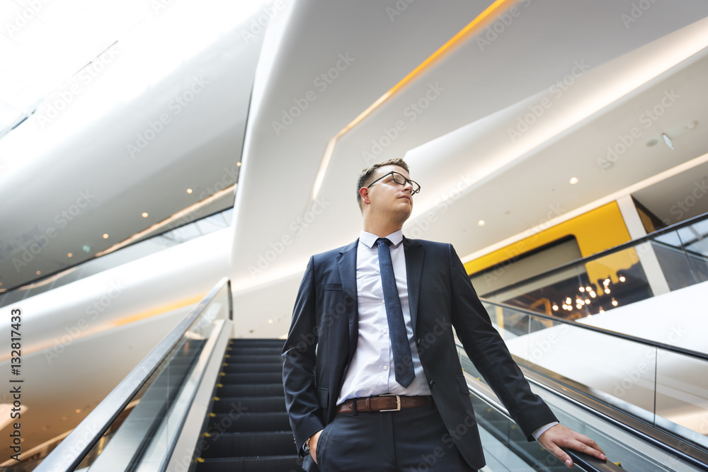 Business Man Looking Escalator Thinking Concept