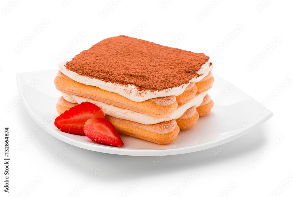 Tiramisu with strawberry on plate isolated. Clipping path