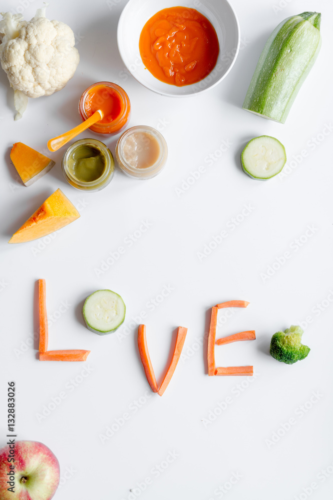 cooking vegetable puree for baby on white background top view