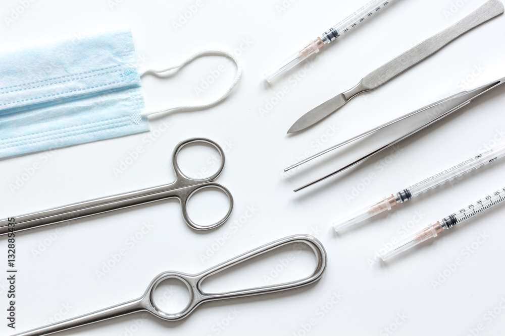 instruments for cosmetic surgery on white background top view