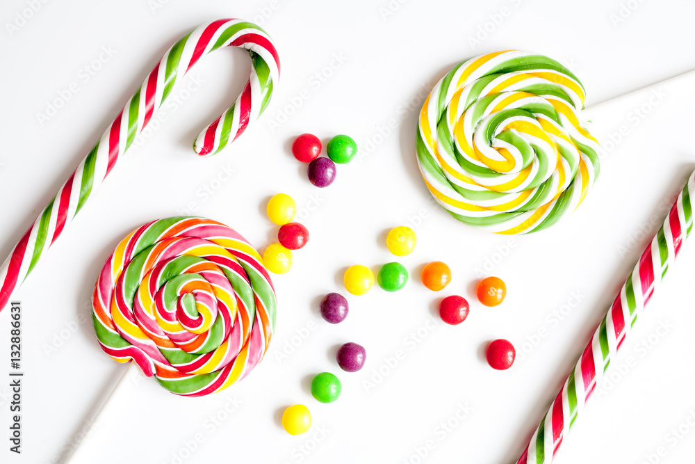 sweets and sugar candies on white background top view