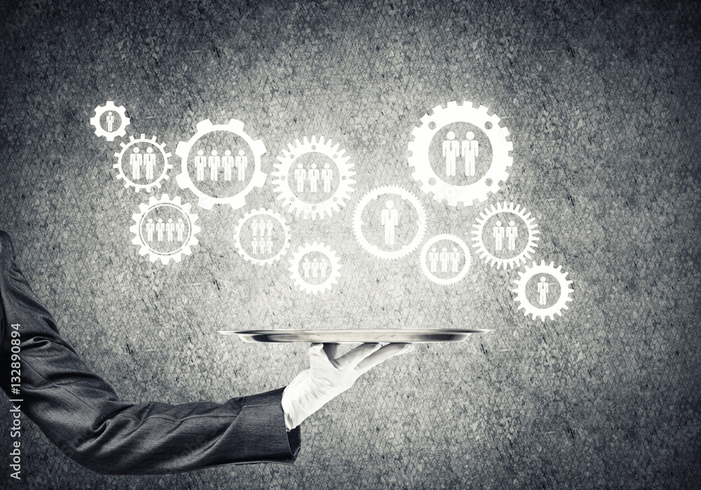 Waiter hand with white gloves holding silver plate full of social media communication icons