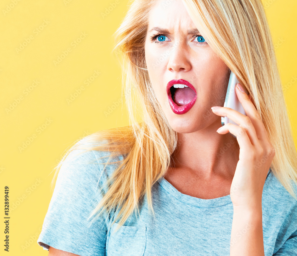 Young woman talking on the phone