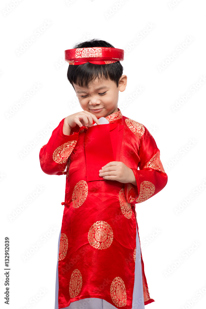 Happy Vietnamese boy in red Ao Dai celebrating New Year with con with con