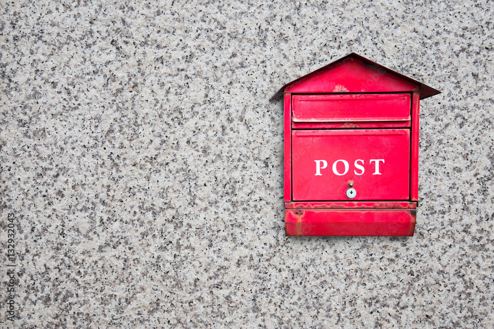 red post box on wall