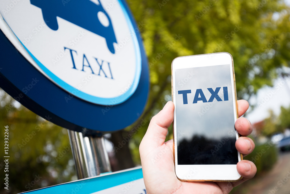 mobile phone and taxi sign on street in seoul