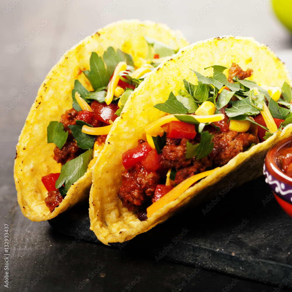 Mexican tacos with meat, beans and salsa